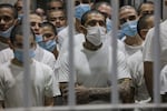 Alleged gang members seen in a cell at the Terrorism Confinement Center (CECOT) in Tecoluca, El Salvador.