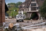 A Duke Energy lineman works on a line the Biltmore Village in the aftermath of Hurricane Helene on Sept. 28 in Asheville, N.C.