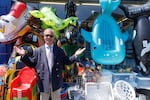 Reform UK leader Nigel Farage stops outside a bucket and spade shop for a photograph while speaking to members of the public on the High Street on July 08, 2026 in Frinton-on-Sea, England.