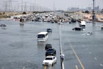 Atypically heavy rains in the United Arab Emirates on Monday and Tuesday caused flooding, flight cancellations and school closures. Vehicles were abandoned on highways like this one in Dubai.