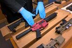 FILE - In this file photo taken Wednesday, Nov. 27, 2019, is Sgt. Matthew Elseth with "ghost guns" on display at the headquarters of the San Francisco Police Department in San Francisco. A federal appeals court in San Francisco has ruled that plans for 3D-printed, self-assembled "ghost guns" can be posted online without U.S. State Department approval. The San Francisco Chronicle says the 2-1 decision was made Tuesday, April 27, 2021, by the 9th U.S. District Court of Appeals. (AP Photo/Haven Daley,File)