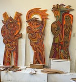 Betty LaDuke's wood panel tryptych "Fire, Fury and Resilience," in her Ashland studio in October 2021.
