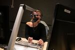 Radio host Hadar Marks speaks on air during Israel's top drive-time morning show on the country's most popular music channel, Galgalatz. She plays songs dedicated to Israeli hostages in Gaza. "I really think that they are listening to us," Marks says.