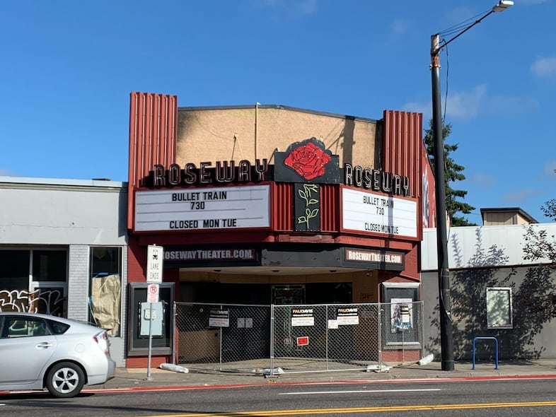 Chain-link fencing can be seen in front of the Roseway Theater in Northeast Portland.