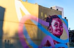 The mural entitled "Under the Same Sky" by artist Kevin Ledo situated at the intersection between Southwest Harvey Milk Street and Southwest 2nd Avenue in downtown Portland, Ore., on Nov. 27, 2023.