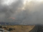 Fire activity along I-84 is shown in this supplied photo, posted on July 25, 2024. The freeway was closed in Eastern Oregon as flames from the Durkee Fire approached the roadside. Thunderstorms hit the area with lightning and high winds, but also brought some much-needed rain. The freeway has reopened but officials say the fire remains unpredictable.