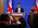British Prime Minister Rishi Sunak reacts as he answers journalists' questions at the Downing Street Briefing Room, in central London, on April 22, regarding a plan for Britain to transfer migrants to Rwanda.