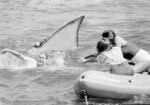 Actresses Desiree Kerns, left, in water, Donna Wilkes, center, and Colleen Barber, right in a staged publicity photo for "Jaws 2" off the coast of Southern California on Monday, June 12, 1978. (Lennox McLendon/AP)