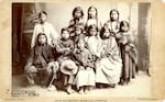 Eleven Spokane children were photographed in Portland in July 1881 on their way from what is now Eastern Washington to the Forest Grove Indian Training School. Historians believe Martha Lot, the daughter of Chief Lot, is the tallest girl in the back row. She died in Forest Grove and is believed to be buried in an unmarked grave in the city cemetery.