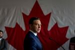 Canada's Conservative Party Leader Pierre Poilievre speaks at a news conference during a campaign event on April 14, 2025 at the Holiday Inn & Suites in Montreal.