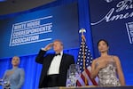 President Donald Trump attends the White House Correspondents' Association Dinner, at the Waldorf Astoria Washington DC, Friday, July 24, 2026, in Washington, with with WHCA president Weijia Jiang, right and White House press secretary Karoline Leavitt.