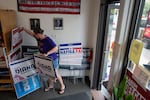 Cora Kirkpatrick sorts through yard signs for candidates at the Washington County Democrats headquarters in Hillsboro, Sept. 12, 2026.
