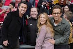 Wrexham co-owners Ryan Reynolds (from right), his wife Blake Lively and Rob McElhenney pose with fans before the English League One soccer match between Wrexham and Charlton Athletic at the Racecourse ground in Wrexham, Wales, on April 26, 2025.