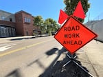 Work zones are characterized by any work being done to a road or beside it, including towing or utility work.