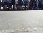 Children lined up with their parents to get tested for lead exposure, outside Rose City Park School, June 6 2016. 