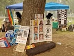 A Black Lives Matter flag and posters memorializing Black Americans killed by police in recent years are displayed at Hawthorne Park in September 2020. The park was swept by police on Sept. 22, resulting in 11 arrests.