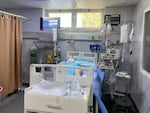 A patient in European Gaza hospital this weekend — the last functioning hospital in Rafah. Staff placed an insect zapper above his bed to keep away the flies.