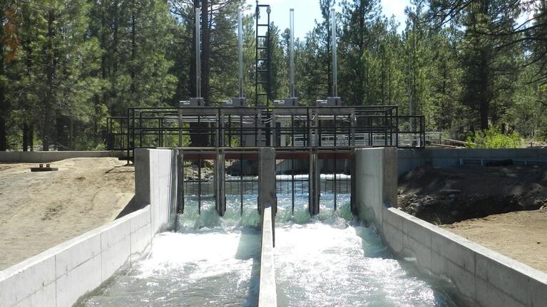 Water flows through part of a screen meant to prevent fish from swiming into a Three Sisters Irrigation District diversion along Wychus Creek.