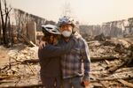 Wed., Jan 8: Claudio and Kathleen Boltiansky embrace in their fire-ravaged neighborhood.