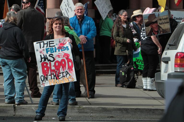 A supporter of LaVoy Finicum holds a sign outside the federal courthouse in Portland on March 5, 2016.