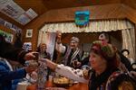 After the rehearsal the theater troupe has drinks and shares some meats and cheeses together.