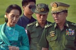 FILE - In this May 6, 2016, file photo, Aung San Suu Kyi, left, Myanmar's foreign minister, walks with senior General Min Aung Hlaing, right, Myanmar military's commander-in-chief, in Naypyitaw, Myanmar. Myanmar military television said Monday, Feb. 1, 2021 that the military was taking control of the country for one year, while reports said many of the country’s senior politicians including Suu Kyi had been detained.