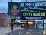 A memorial billboard posted in downtown Woonsocket, R.I. in 2023, by friends of Jennifer Dubois. The billboard features her 19-year-old son, Clifton, who died in 2020 of a drug overdose. 