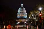 The Capitol is seen behind reinforced barricades as the second impeachment trial of former President Donald Trump begins in the Senate in Washington, Tuesday, Feb. 9, 2021. Trump was charged by the House with incitement of insurrection for his role in agitating a violent mob of his supporters that laid siege to the U.S. Capitol on Jan. 6, and sent members of Congress into hiding as they met to validate President Joe Biden's victory.