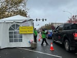 Voters drive through a ballot drop-off site in front of the Marion County Courthouse in downtown Salem on Monday, Nov. 4, 2024.