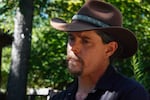 Drew Merritt of Mosier, who was among the dozens of people who attended an informational meeting to learn more about Prescribed Burn Associations, looks on during an interview at his plant nursery in Mosier, Ore., on July 8, 2026.