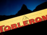 A Toblerone chocolate bar, pictured with the Matterhorn in the background. The company will replace the iconic peak on its label with a more generic mountain as a result of manufacturing changes.