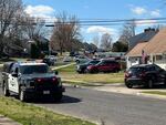 Police patrol the Levittown area after deadly shootings on Saturday in Falls Township, Pa.