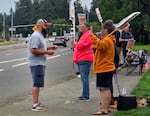 An undated provided photo of Brett Smith talking with people on a picket line. Smith is a former welder, mill worker and maintenance man.