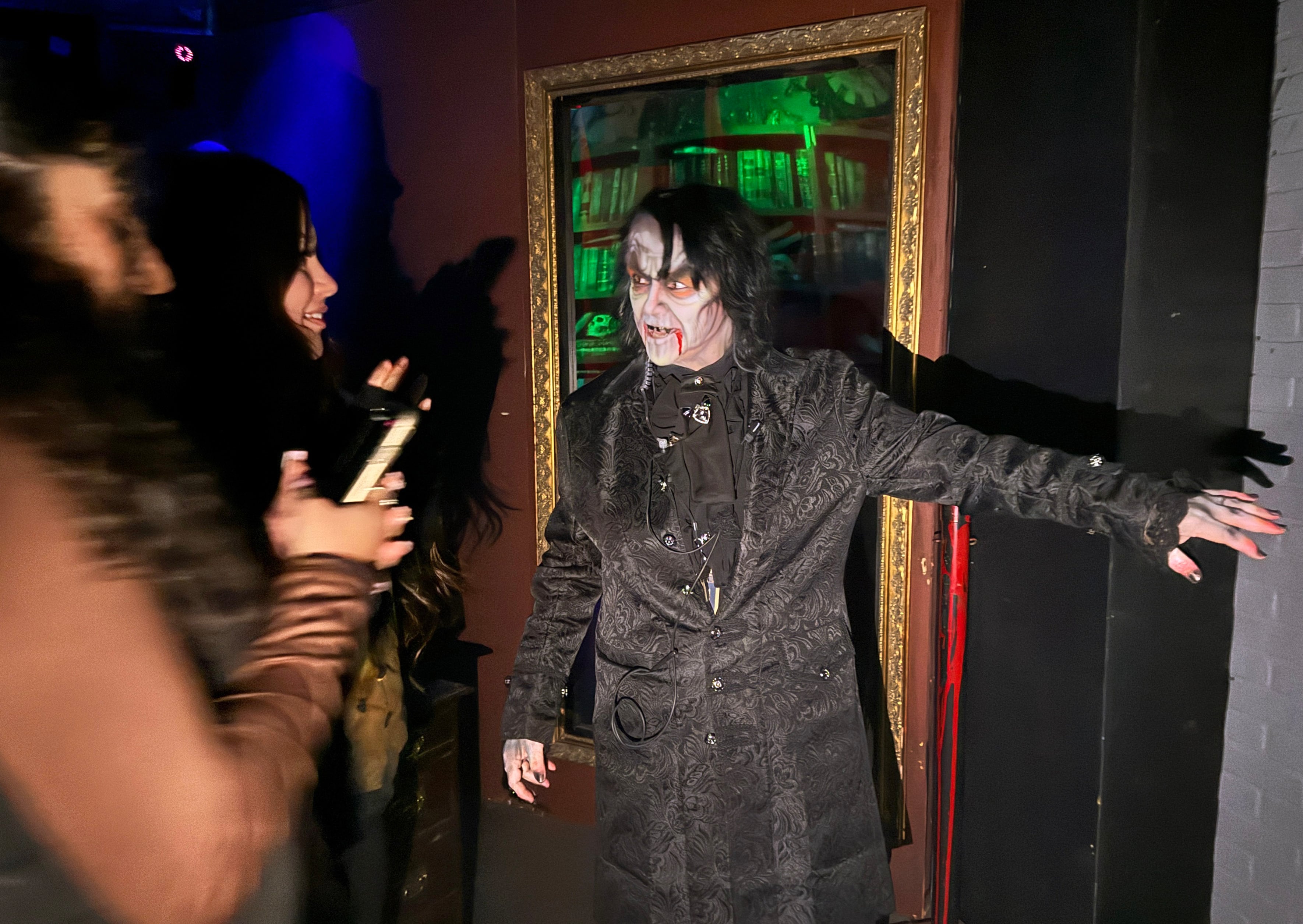 Shell Galloway welcomes customers into the Underhill Haunted House, located in the basement of the Veteran’s Memorial Coliseum in Portland on October 25, 2024.