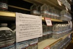 A Roth's Fresh Markets grocery store in Salem asks customers to limit water purchases to two cases of 16.9-ounce bottles or 4 gallons of water per family.