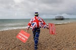 Anti Brexit campaigner Steve Bray walks on the beach to pose for a photograph during the Labour Party Conference at the Brighton Centre in Brighton, England, Monday, Sept. 23, 2019.