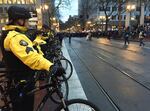 Portland police line the streets of the city's downtown on Jan. 20, 2017, in response to hundreds of demonstrators marching through the streets in protest of the inauguration of President Donald Trump.