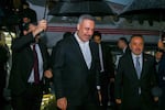 In this photo released by the Pakistan Ministry of Foreign Affairs, Turkish Foreign Minister Hakan Fidan, center, walks toward his car upon arrival to attend a meeting in Islamabad, Pakistan, Saturday, March 28, 2026.