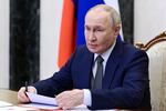 Russian President Vladimir Putin chairs a Security Council meeting via videoconference at the Kremlin in Moscow, Friday.