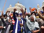 Supporters of Waris Punjab De organization shout slogans favoring their chief and separatist leader Amritpal Singh and other arrested activists during a meeting at the Akal Takht Secretariat inside Golden Temple complex, in Amritsar, India, on March 27, 2023.