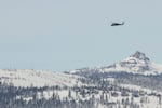 A U.S. Army Blackhawk helicopter flies toward the Castle Peak area of Northern California in recovery search for skiers on Saturday, after one of the deadliest avalanches in state history.