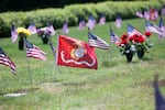 A U.S. Marine Corps. flag flies over the grave of a fallen Marine at the Willamette National Cemetery in 2016.