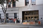 People wait outside immigration court of the US immigration and customs enforcement field office on Oct. 24, 2025, in San Francisco