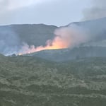 In this photo provided by Wheeler County Fire & Rescue, the Butte Creek Fire burns on a hillside near Clarno, Ore. The fire was first reported on May 25, 2025.