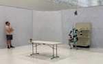 Agility Robotics research engineer Jonah Siekmann works in an area of the company's warehouse used to research and test artificial intelligence integration for Digit.