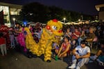 A lion dancer mingles with the audience at the Jade International Night Market held at Portland Community College campus in Southeast Portland, Ore., on Aug. 19, 2023.