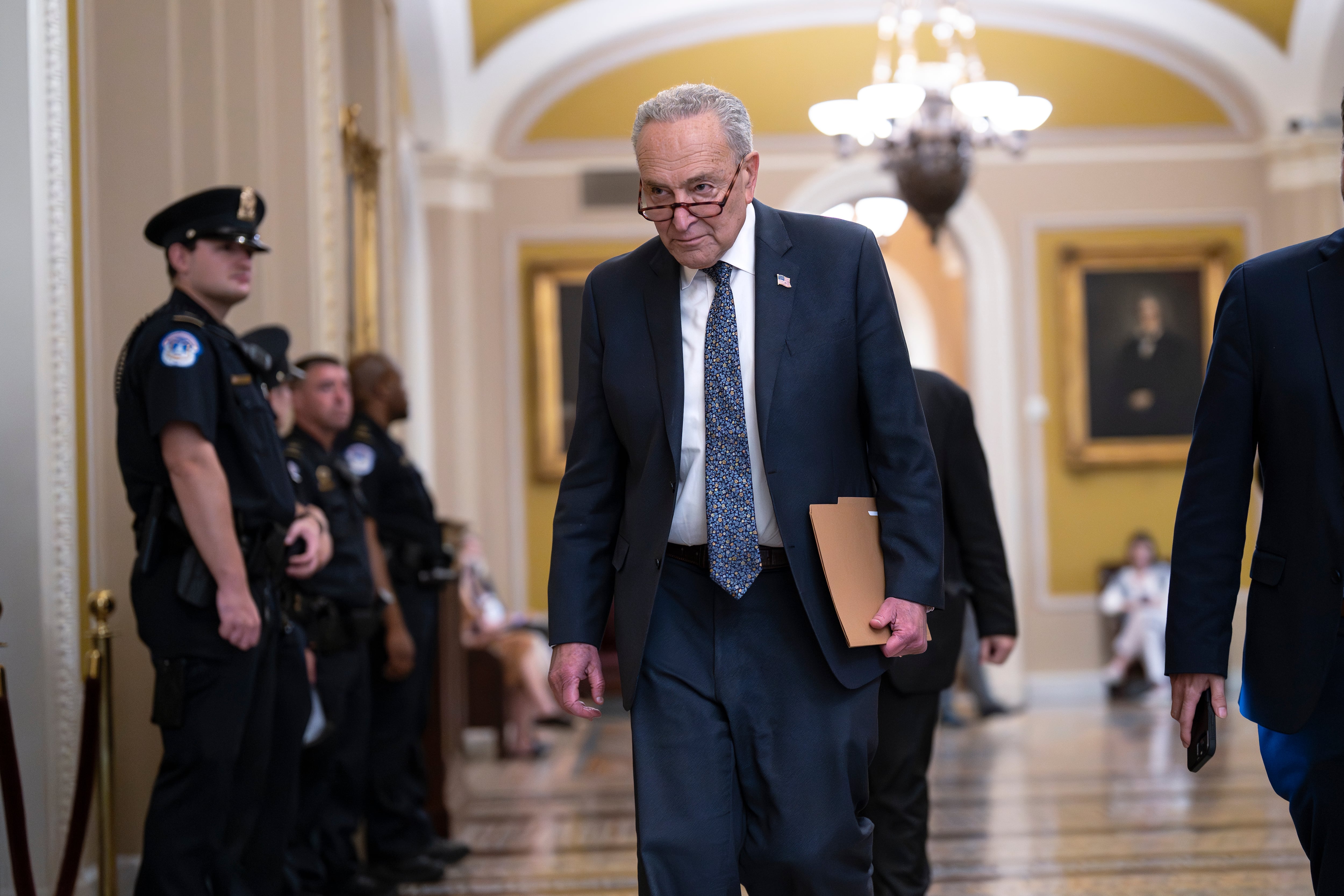 Senate Minority Leader Chuck Schumer, D-N.Y., arrives at the chamber as Republicans secure passage of the budget reconciliation package of President Donald Trump's signature bill of big tax breaks and spending cuts, at the Capitol in Washington, Tuesday, July 1, 2025.