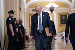 Senate Minority Leader Chuck Schumer, D-N.Y., arrives at the chamber as Republicans secure passage of the budget reconciliation package of President Donald Trump's signature bill of big tax breaks and spending cuts, at the Capitol in Washington, Tuesday, July 1, 2025. 