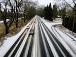 Snow blankets Highway 99E through Portland on Sunday, Dec. 24, 2017.