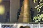 Police on the steps of the Multnomah County Justice Center aim less lethal weapons at protesters demonstrating against police brutality and racist violence in Portland, Ore., June 5, 2020.